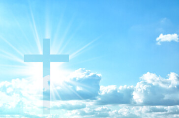 Wall Mural - Silhouette of cross against blue sky. Christian religion