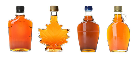 Wall Mural - Set with bottles of tasty maple syrup on white background. Banner design
