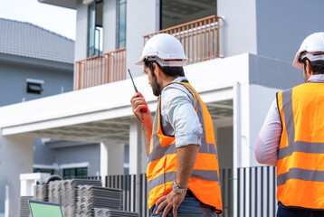 Poster - Engineers group consult construction on site building working at construction site,Construction residential new house in progress at building site.
