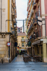 Wall Mural - A view of a typical side street in the centre of Alicante on a spring day
