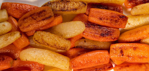 Chicken Hunter recipe with glazed root vegetables, carrot, turnip with its mushroom sauce deglazed in white wine and wet with the chicken stock