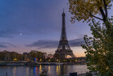 Fototapeta Boho - Purple Sky in Paris at Twilight Sunset Over Eiffel Tower With Moon and Trees