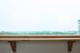 Fototapeta  - Wooden shelf over white wall with glass window