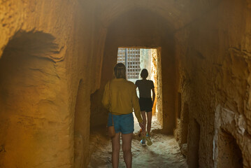 Poster - Family visiting Tombs of the Kings in Paphos.