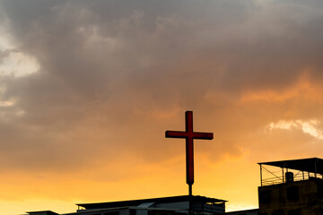 Wall Mural - Countryside church with cross under sunset