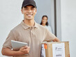 © Siphosethu F/peopleimages.com - Proud to bring customers their packages. Shot of a young delivery man delivering packages to a customer.
