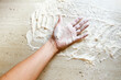 Hand in flour