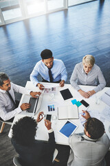 Poster - Working with great ambitions. Shot of a group of businesspeople having a meeting in an office.