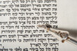 A silver pointer used in guiding the reader of the Jewish Bible or Torah points to the opening verse of parashat Noach, the second reading in the book of Genesis.