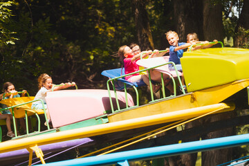 Wall Mural - The children experience great emotions of roller coaster riding