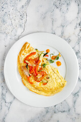 Wall Mural - omelet with fresh vegetables, top view