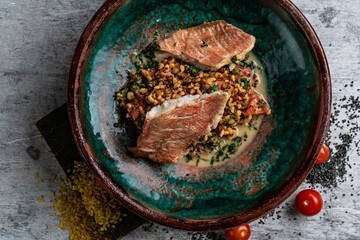 Canvas Print - Roasted Pike perch with spelt and Polish sauce. Dish decorated with a spinach. Restaurant menu