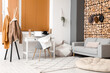 © Pixel-Shot - Interior of modern room with workplace, sofa and coat rack