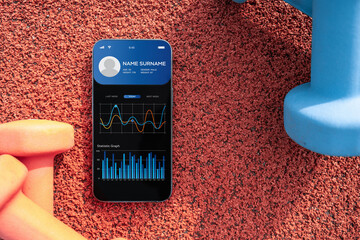 Gym app. Smartphone screen with sport gym or fitness health mobile application on dumbbell background. App for training indoors.