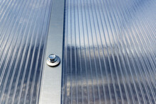 Polycarbonate Greenhouse, Fixing Metal Arcs With Screws. Compound Polycarbonate Plastic Sheet And Frame