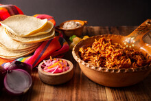 Cochinita Pibil. Typical Mexican Stew From Merida, Yucatan, Made From Pork Marinated With Achiote And Generally Accompanied With Beans And Red Onion With Habanero Chili, It Can Be Eaten In Tacos.
