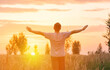 © Сергей Храмов - Freedom. A man looks at the setting sun with his arms outstretched