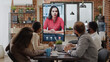 © DC Studio - Colleagues meeting with woman on video call conference, using remote video teleconference on monitor. Business people working with online videoconference during covid 19 pandemic.