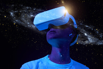 Wall Mural - man is using virtual reality headset. elements of this image furnished by nasa.