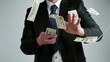 © Jag_cz - Close-up of a young businessman throwing out money banknotes