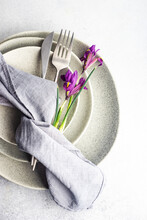 Overhead View Of A Spring Floral Place Setting With Purple Iris Flowers