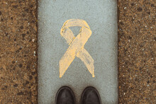 Overhead View Of A Person Standing By A Yellow Ribbon Symbolising Pro-independence Movement, Catalonia, Spain