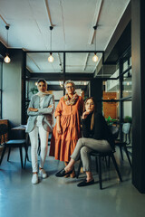 Wall Mural - Diverse businesswomen looking at the camera in an office