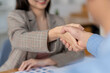 © crizzystudio - Professional Business partner handshake after planing planning and presentation project at meeting working and analysis at workspace, financial and handshake concept to congratulate.