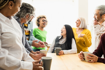 Wall Mural - Happy multiracial people with different ages and ethnicities having fun drinking a cup of coffee at home