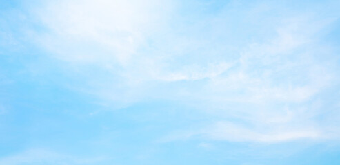 Wall Mural - abstract white puffy clouds and blue sky background.