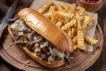 Wall Mural - Philly cheesesteak sandwich and french fries