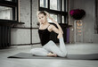 © splitov27 - Slim sportive attractive woman practicing yoga, Rajakapotasana poses, workout, wearing sportswear, yoga studio