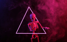 Skeleton In Dense Smoke, Triangle With Red Blue Neon Light. Scary, Halloween Theme
