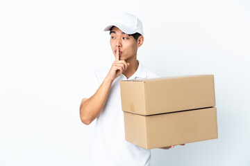 Poster - Delivery Chinese man isolated on white background showing a sign of silence gesture putting finger in mouth