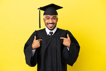 Poster - Young university graduate Colombian man isolated on yellow background with surprise facial expression