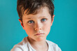 © ADDICTIVE STOCK - Sad boy looking down in studio