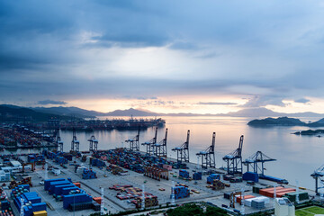 Wall Mural - Containers in the port at dusk