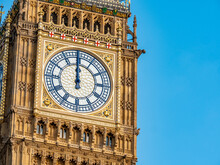 Big Ben At Midday. Close Detail Of The Face To The Iconic London Landmark Clock Tower At Exactly 12 O'clock Mid Day.