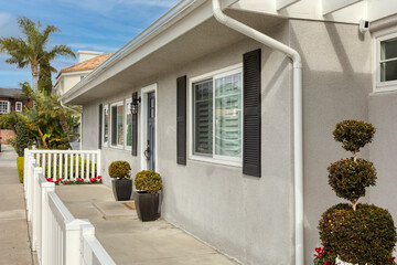 Wall Mural - white house in the village with a white picket fence and a front porch