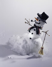 Snowman In A Snow Covered Field
