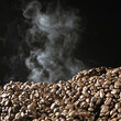 © SuperStock - Smoke rising from a pile of coffee beans