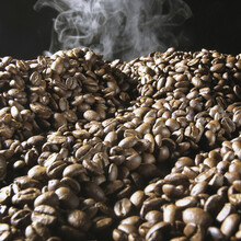 Smoke Rising From A Pile Of Coffee Beans