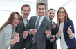 © ASDF - A group of business people standing and pointing at you