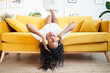 © CarlosBarquero - Beautiful motivated young woman excited at home enjoys listening music with headphones