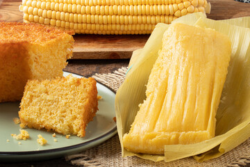 Traditional Junina party foods. Pamonha and corn cake.