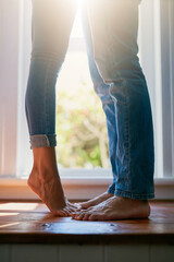 Wall Mural - Reaching for a kiss. Cropped shot of an unrecognizable couple kissing at home.