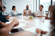 © Micah C/peopleimages.com - I had my doubts but it turned out well. Shot of a group of businesspeople listening to a colleagues ideas during a meeting.