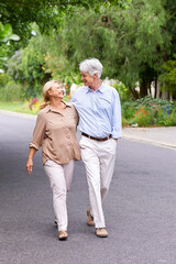 Wall Mural - Love never dies. Shot of a happy senior couple walking.