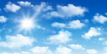 Sunny Day Background, Blue Sky With White Cumulus Clouds And Sun, Natural Summer Or Spring Background