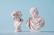 Two white Roman or antique style Grecian busts